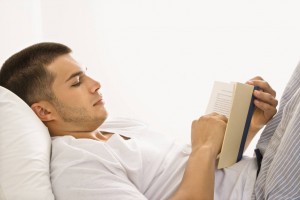 04-man-reading-book-in-bed